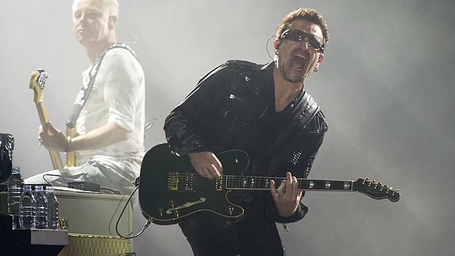 Body pains ... Bono, right, and Adam Clayton, from the rock group U2. Picture: AFP
