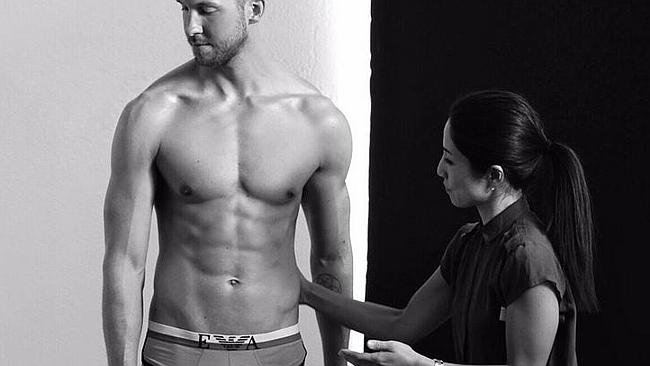 Behind the scenes ... Harris posted several shots from his Emporio Armani shoot yesterday
