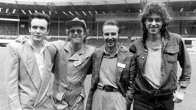 Charity legend ... Adam Ant and Elton John with Live Aid bosses Midge Ure and Bob Geldof.