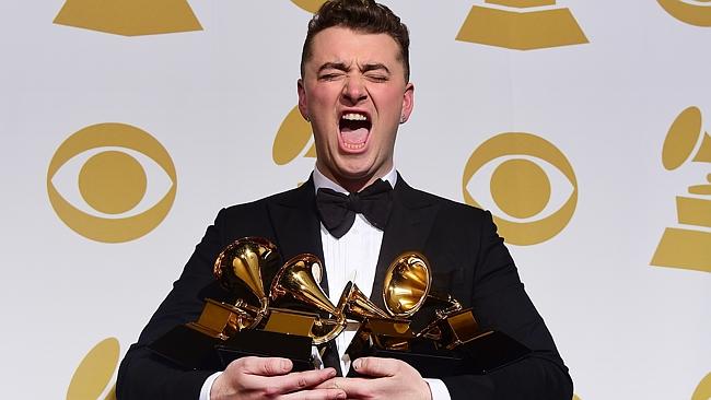 Sam Smith holds his four awards at the 57th annual Grammy Awards in Los Angeles this mont