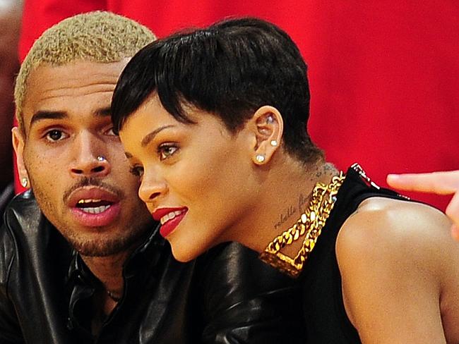 Rihanna and Chris Brown attending an NBA game in December 2012.