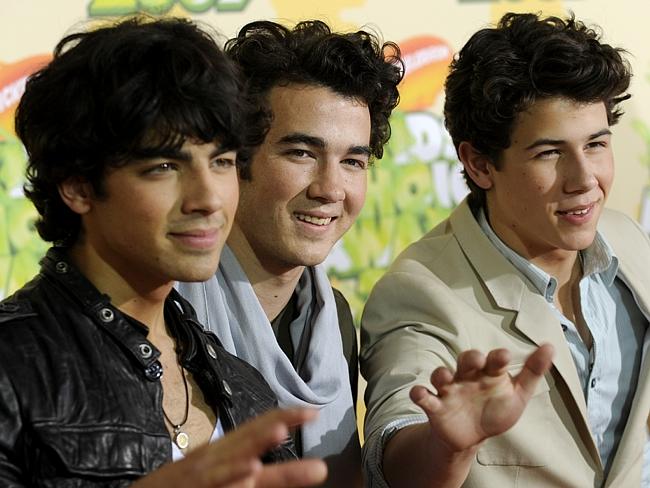 Nick Jonas (far right) with his brothers Kevin (centre) and Joe (left) as the Jonas Broth