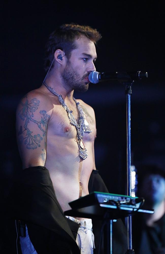 Shirt off ... Johns got his rock god on at the APRA Awards when performing his new single