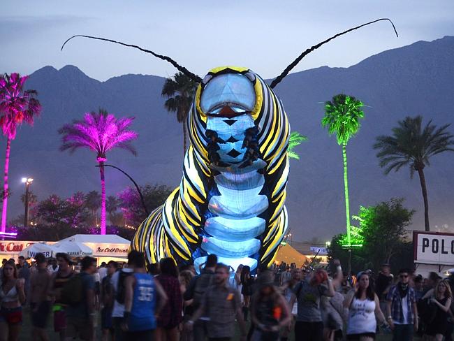Not just about the music ... a giant caterpillar moves through the crowd. Picture: AFP PH