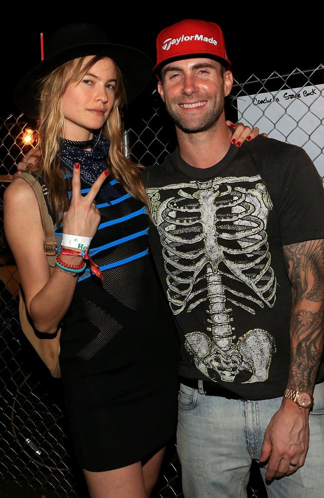 The beautiful people ... model Behati Prinsloo and musician Adam Levine pictured at the E