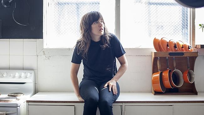 Courtney Barnett not squatting, thinking.