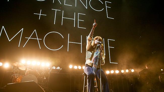 Go with the Flo ... Florence Welch rests her broken foot on stage in California this mont