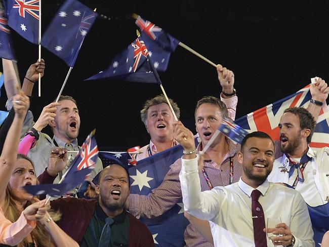 Guy Sebastian, front right, representing Australia waves an Australian flag during the fi