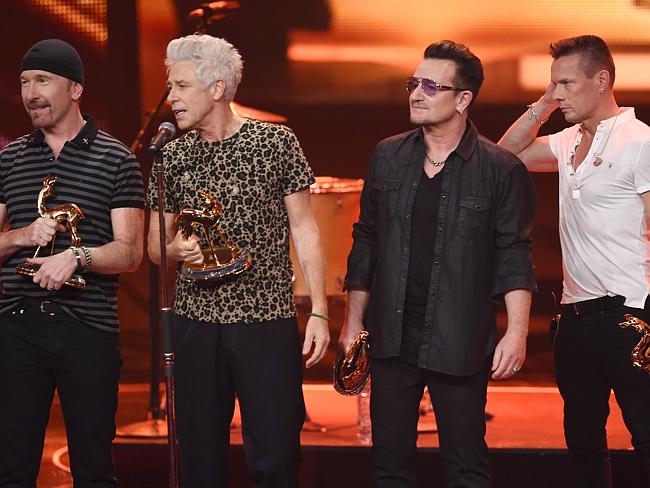 Renewed ... The members of the band U2, (L-R) The Edge, Adam Clayton, Bono and Larry Mull