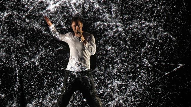 Eurovictor: Sweden's Mans Zelmerlow gets digital on stage. AFP PHOTO / DIETER NAGL