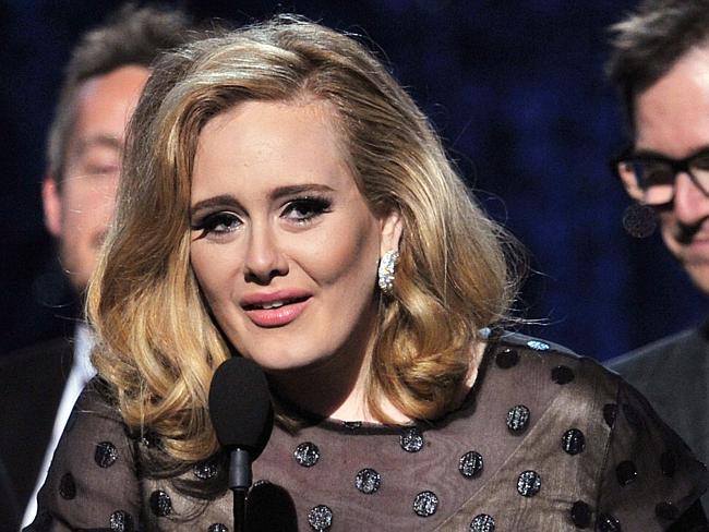 Award winner ... Singer Adele accepts the award for 'Album of the Year' at the 2012 Gramm