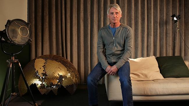 English musician Paul Weller poses for photographs at Parlophone Records in central Londo