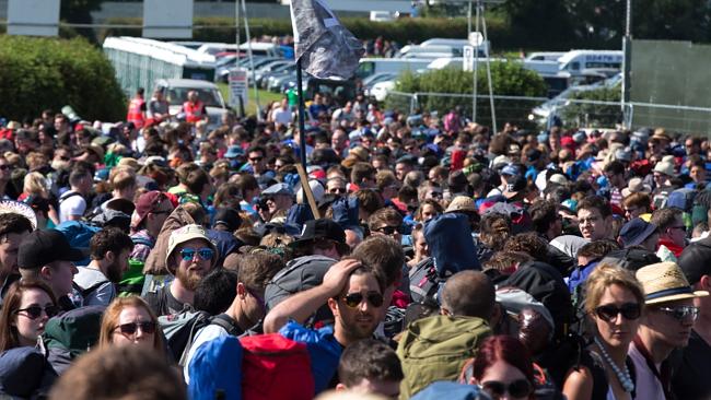 Luckily the Brits don’t mind a queue. Fans line up to enter Glastonbury. Picture: Jim Ros