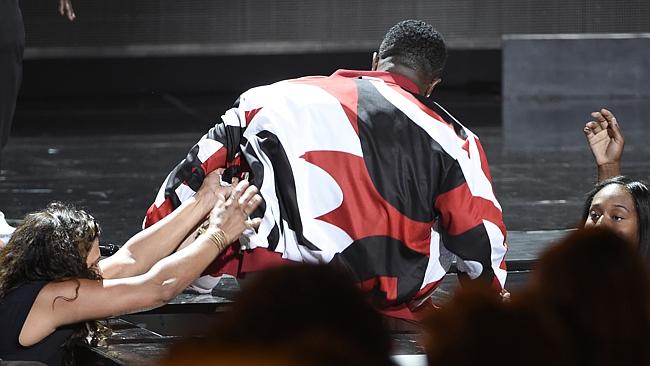 Sean "Diddy" Combs falls while he performs at the BET Awards.