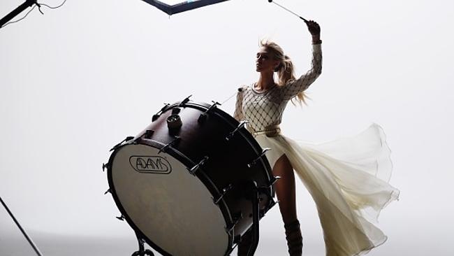 Drummer girl ... Delta Goodrem hits out in the video for her new single Wings. Picture: S