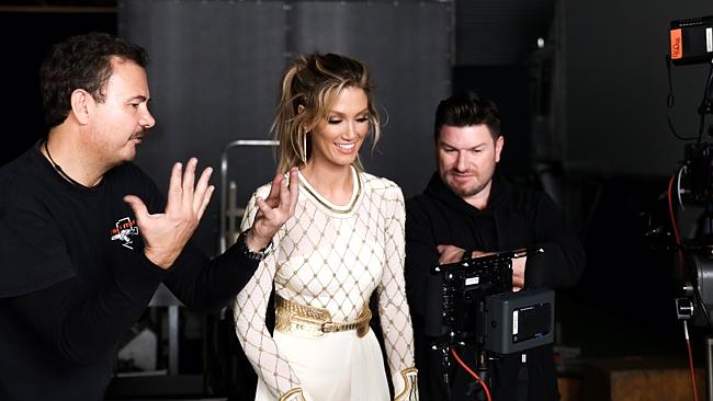 Behind the scenes ... Goodrem checks out the progress on her video shoot. Picture: Suppli