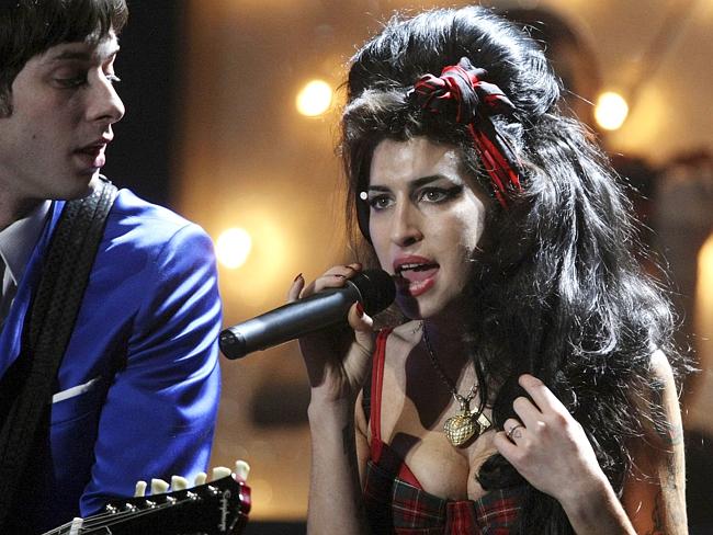Close friends ... Mark Ronson and late British singer Amy Winehouse perform at the Brit A