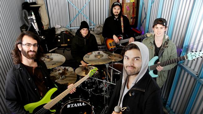 Hard workers ... Northlane rehearse in a tiny storage unit in Penrith. Picture: Peter Kel